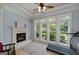 Spacious living room with a fireplace and a ceiling fan at 825 Chalet Hls, Mcdonough, GA 30253
