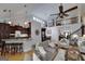 Open-concept living room showcasing hardwood floors, a fireplace, and wrought iron staircase at 825 Chalet Hls, Mcdonough, GA 30253