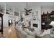 Spacious living room boasting a fireplace, high ceilings, and an open floor plan layout at 825 Chalet Hls, Mcdonough, GA 30253