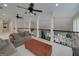 This upstairs loft area has plush carpeting, comfortable seating, and ornate railing at 825 Chalet Hls, Mcdonough, GA 30253