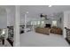 This spacious loft area has neutral carpet, white pillars, an ornate railing, and comfortable seating at 825 Chalet Hls, Mcdonough, GA 30253