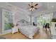 Spacious main bedroom with a fireplace and ceiling fan at 825 Chalet Hls, Mcdonough, GA 30253