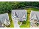 Aerial view showcasing the home's roof, landscaping, and its proximity to surrounding greenery and neighboring houses at 4613 Beau Point Ct, Snellville, GA 30039