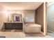 Bathroom featuring a double sink vanity, soaking tub, and tile floor at 4613 Beau Point Ct, Snellville, GA 30039