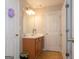 Bathroom featuring a wooden vanity with a large mirror and tiled floors at 4613 Beau Point Ct, Snellville, GA 30039