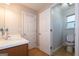Bathroom featuring a vanity with chrome faucet, tiled floor, and a toilet at 4613 Beau Point Ct, Snellville, GA 30039