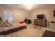 Comfortable bedroom with ample natural light, a ceiling fan, and carpet at 4613 Beau Point Ct, Snellville, GA 30039