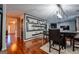 Open floorplan dining room features hardwood floors and decor shelving at 4613 Beau Point Ct, Snellville, GA 30039