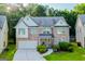 Charming two-story home with a brick facade, well-manicured lawn, and an attached two-car garage at 4613 Beau Point Ct, Snellville, GA 30039