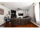 View of the cozy living room featuring a fireplace, TV, and hardwood floors at 4613 Beau Point Ct, Snellville, GA 30039