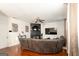 Spacious living room features a fireplace, ceiling fan, and hardwood floors at 4613 Beau Point Ct, Snellville, GA 30039