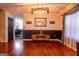 Bright, spacious living room features hardwood floors, stylish decor, and wainscotting accents at 4613 Beau Point Ct, Snellville, GA 30039