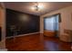 Stylish living room featuring hardwood floors, a geometric wall design, comfortable seating and natural lighting at 4613 Beau Point Ct, Snellville, GA 30039