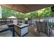 Outdoor patio featuring an outdoor kitchen, dining area, and comfortable seating at 4613 Beau Point Ct, Snellville, GA 30039