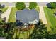 Aerial shot of home with well-maintained lawn, lush greenery, and tree coverage at 145 Seawright Dr, Fayetteville, GA 30215