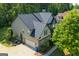 An aerial view of the side of the home shows the roof, landscaping and attached garage at 145 Seawright Dr, Fayetteville, GA 30215