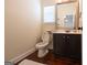 Half bathroom with vanity and hardwood floor at 145 Seawright Dr, Fayetteville, GA 30215