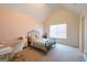 Bedroom featuring a metal bed, a desk, vaulted ceilings, and neutral colored walls at 145 Seawright Dr, Fayetteville, GA 30215