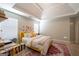 Bright bedroom with stylish decor, a yellow bed, and plenty of natural light at 145 Seawright Dr, Fayetteville, GA 30215