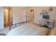 Bedroom featuring a metal bed, and open doorway, desk and neutral colored walls at 145 Seawright Dr, Fayetteville, GA 30215