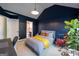 Comfortable bedroom with blue walls, a well-lit window, and a charming decor at 145 Seawright Dr, Fayetteville, GA 30215