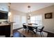 Elegant dining room features modern lighting, table with six chairs, and natural light at 145 Seawright Dr, Fayetteville, GA 30215