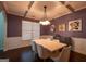 Dining room with modern table and chairs, coffered ceilings, hardwood floors and wainscotting at 145 Seawright Dr, Fayetteville, GA 30215