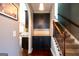 Inviting entryway with hardwood floors, staircase, and built-in cabinetry with granite countertop at 145 Seawright Dr, Fayetteville, GA 30215