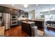 Stylish kitchen with stainless steel appliances, granite countertops, dark cabinets, and center island at 145 Seawright Dr, Fayetteville, GA 30215