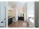 Elegant main bathroom with double vanities, a soaking tub, and separate shower, creating a spa-like retreat at 145 Seawright Dr, Fayetteville, GA 30215