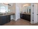 Main bathroom boasts dual vanities, granite countertops, and private toilet room, offering space and convenience at 145 Seawright Dr, Fayetteville, GA 30215