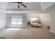 Bright and airy main bedroom with abundant natural light highlighting the neutral decor and tray ceilings at 145 Seawright Dr, Fayetteville, GA 30215