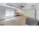 Large main bedroom featuring tray ceilings, fan, and neutral color palette; ready for relaxation and personalization at 145 Seawright Dr, Fayetteville, GA 30215