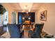 A modern office space showcasing contemporary lighting, desk, and comfortable seating at 145 Seawright Dr, Fayetteville, GA 30215