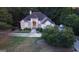 Aerial view of well-maintained home with lush green lawn and driveway at 433 Abbey Springs Way, Mcdonough, GA 30253