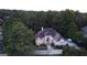 An aerial view of a lovely single-Gathering home surrounded by green trees and a well-maintained lawn at 433 Abbey Springs Way, Mcdonough, GA 30253