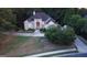 Aerial view of well-maintained home with lush green lawn and driveway at 433 Abbey Springs Way, Mcdonough, GA 30253