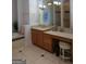 Bathroom with a vanity, sink, drawers, towel rack, stool, and large mirror at 433 Abbey Springs Way, Mcdonough, GA 30253