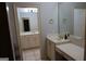 This classic bathroom is equipped with cream-colored walls, cabinets, and granite countertops at 433 Abbey Springs Way, Mcdonough, GA 30253