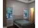 Bedroom featuring hardwood floors, neutral paint, large windows, and ample closet space at 433 Abbey Springs Way, Mcdonough, GA 30253