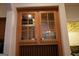 Butler pantry with beautiful wood cabinets with glass fronts and granite countertops at 433 Abbey Springs Way, Mcdonough, GA 30253