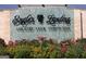 Community entrance sign for Eagle's Landing Country Club with stone accents and vibrant flower beds at 433 Abbey Springs Way, Mcdonough, GA 30253