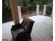 Back deck with outdoor chair with a view of wooded yard at 433 Abbey Springs Way, Mcdonough, GA 30253