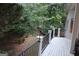 View from deck overlooking backyard with mature trees offering shade and privacy from the home at 433 Abbey Springs Way, Mcdonough, GA 30253