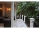 Back deck with seating and railing with view of the yard at 433 Abbey Springs Way, Mcdonough, GA 30253