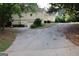 Shot of home showing driveway and landscaping with side entry garage and basketball net on left at 433 Abbey Springs Way, Mcdonough, GA 30253