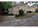 Driveway next to the home with a basketball hoop and lush landscaping at 433 Abbey Springs Way, Mcdonough, GA 30253