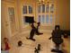 Exercise room with tiled floor, weights, bike and multiple windows at 433 Abbey Springs Way, Mcdonough, GA 30253