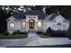 Elegant single Gathering home boasting well maintained lawn and circular driveway leading to the home's front entrance at 433 Abbey Springs Way, Mcdonough, GA 30253