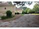 Home shows long driveway, and manicured landscaping add curb appeal to the property's exterior at 433 Abbey Springs Way, Mcdonough, GA 30253